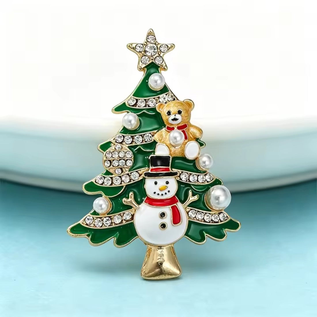 Weihnachtsbaum Brosche blauer Hintergrund Frontansicht