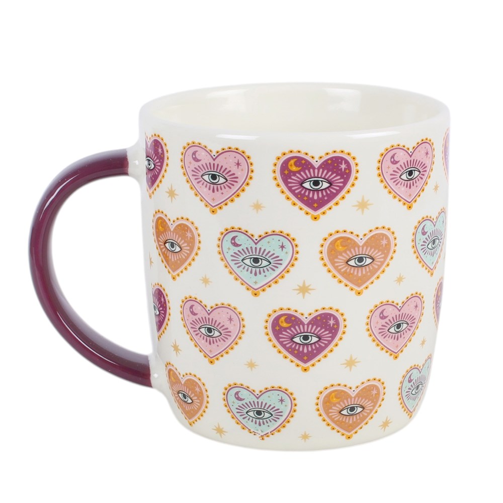 Tasse mit Herz-Augen-Motiv und Teesieb mit Herzanhänger
