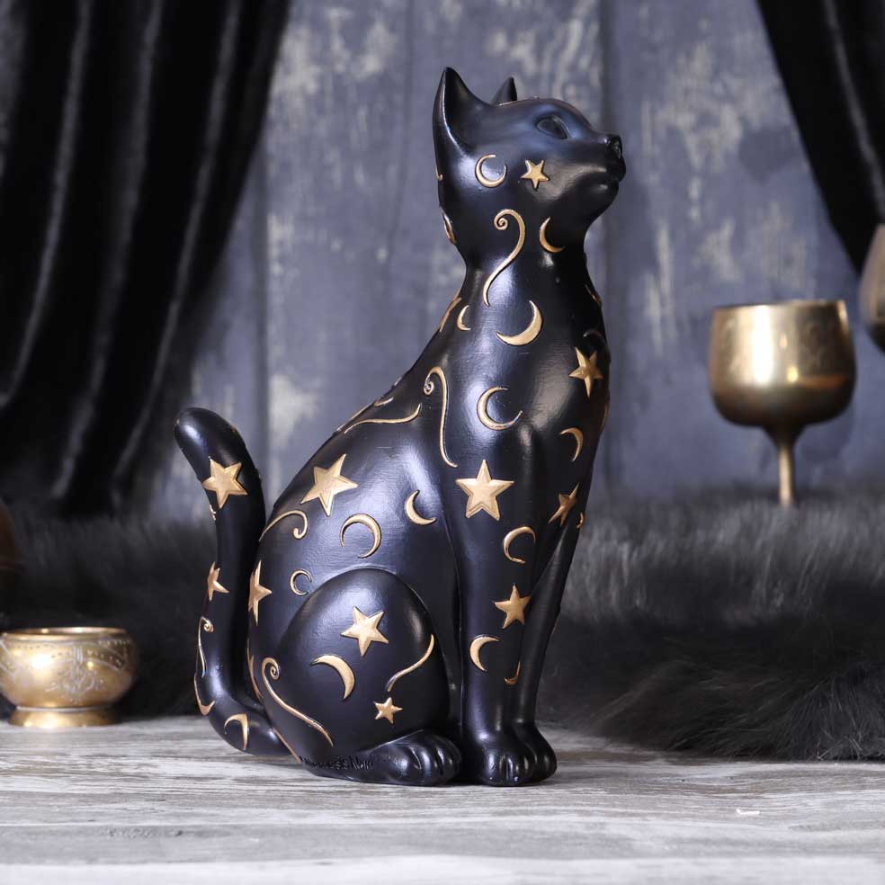 Schwarze Katzenfigur mit goldenen Sternen und Monden