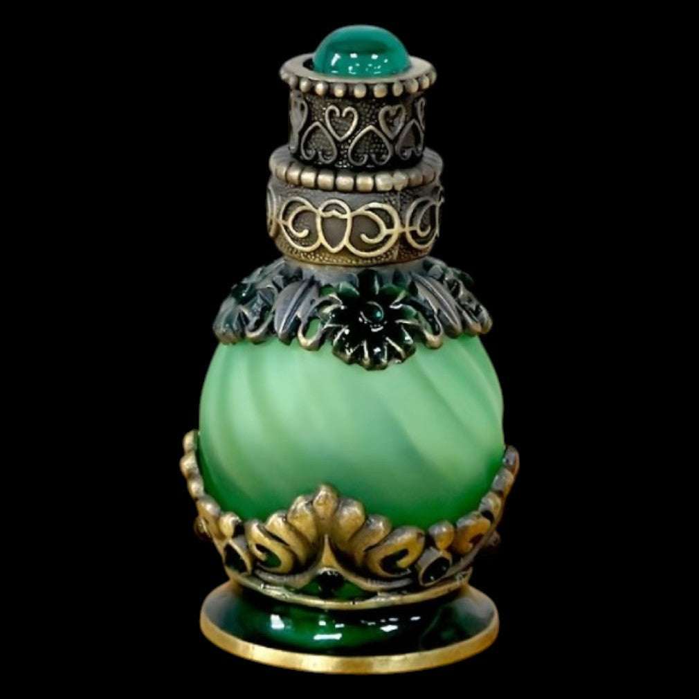 Vintage Parfümflasche smaragdgrün – schwarzer Hintergrund